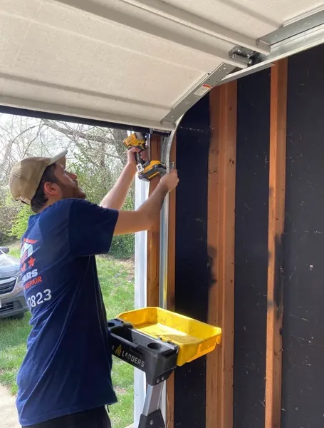 Five Stars Garage Door technician installing track in St. Louis