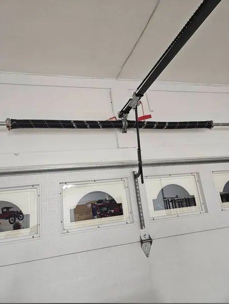 Torsion spring replacement by Five Stars Garage Door technician St. Louis